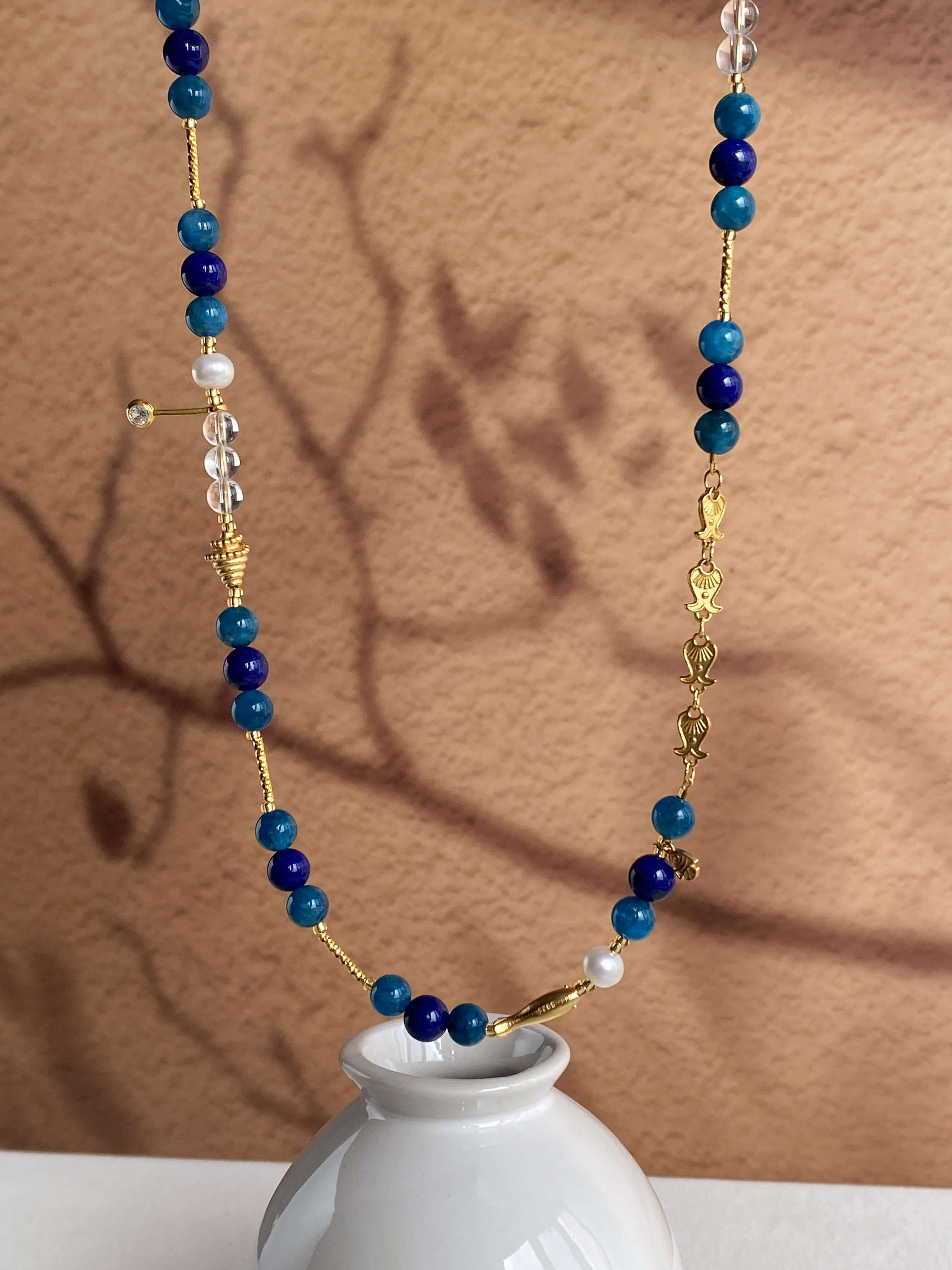 Natural Light Photography of Blue Phosphate Lapis Lazuli Necklace Display